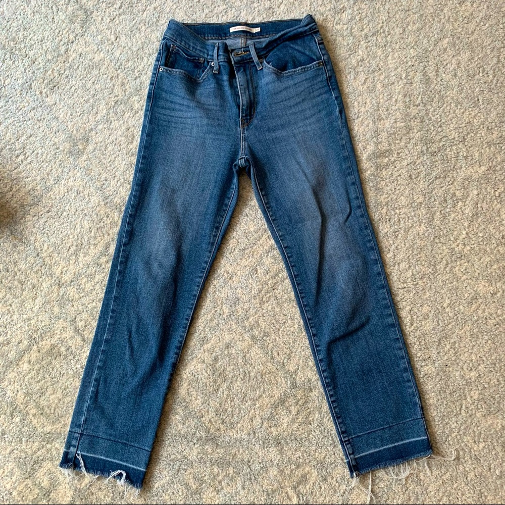 Levi’s 724 frayed bottom jeans